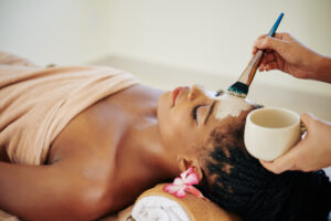 Woman receiving a relaxing facial in Alameda California at Bespoke Wellness.
